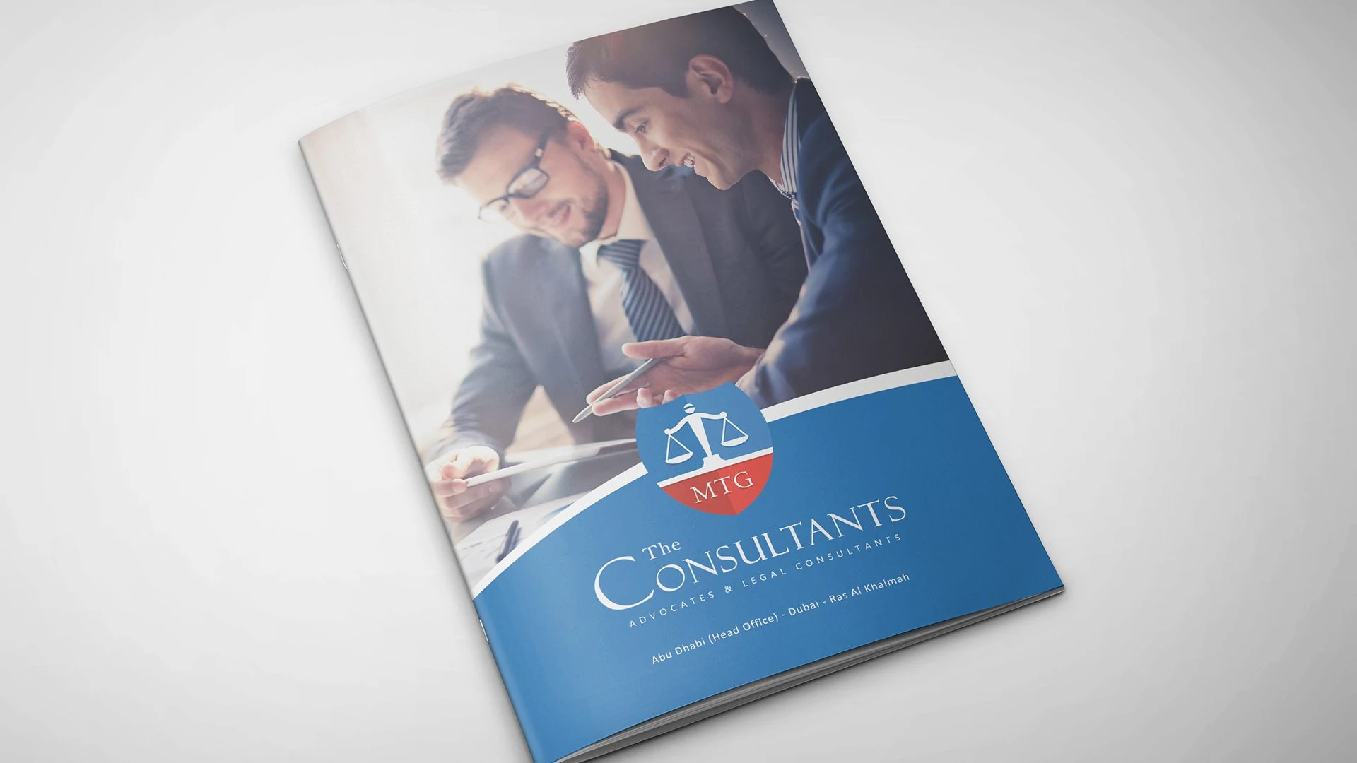 MTG-branded legal consultancy brochure cover with a meeting photograph and blue panel